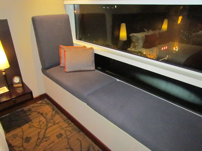 My favourite bit of the room was the long window seat overlooking the pool, waterfall and leafy green trees.